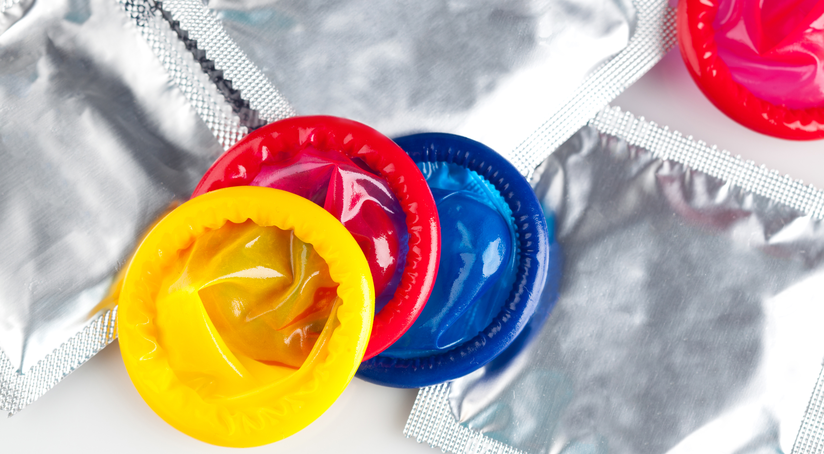 yellow, red, and blue condoms